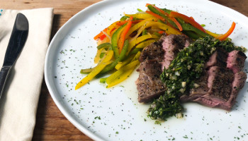 Skirt Steak with Chimichurri, Mixed Peppers, and Onions