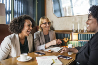 Happy Women at Business Lunch