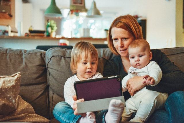 Woman with Children on Couch